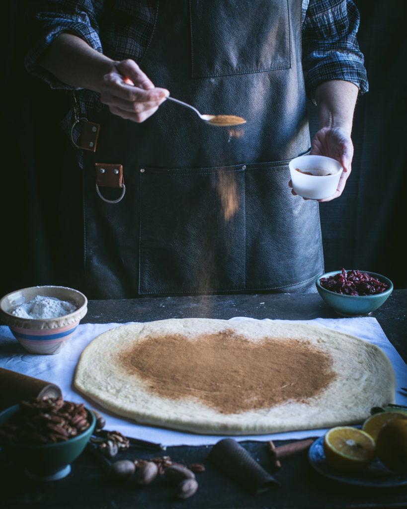 Sprinkle cinnamon over dough
