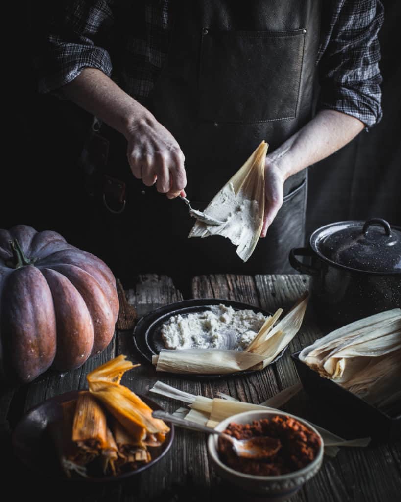 Spreading prepared masa on a corn husk