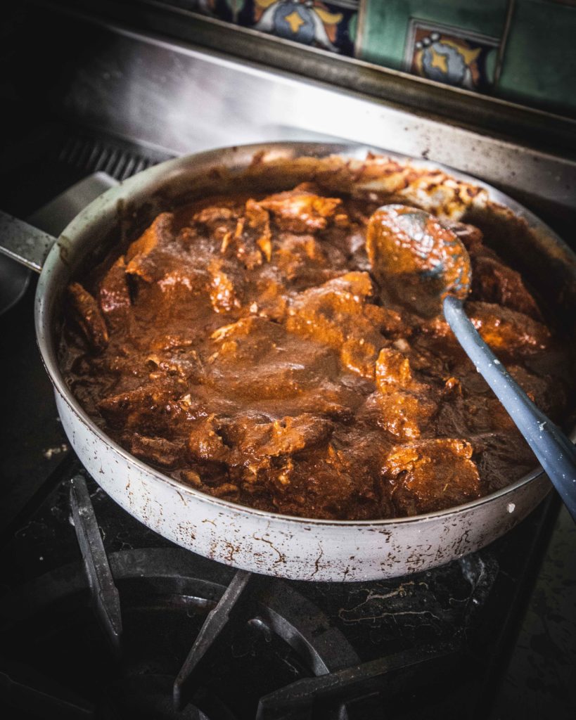 simmering Mole Poblano con Pavo