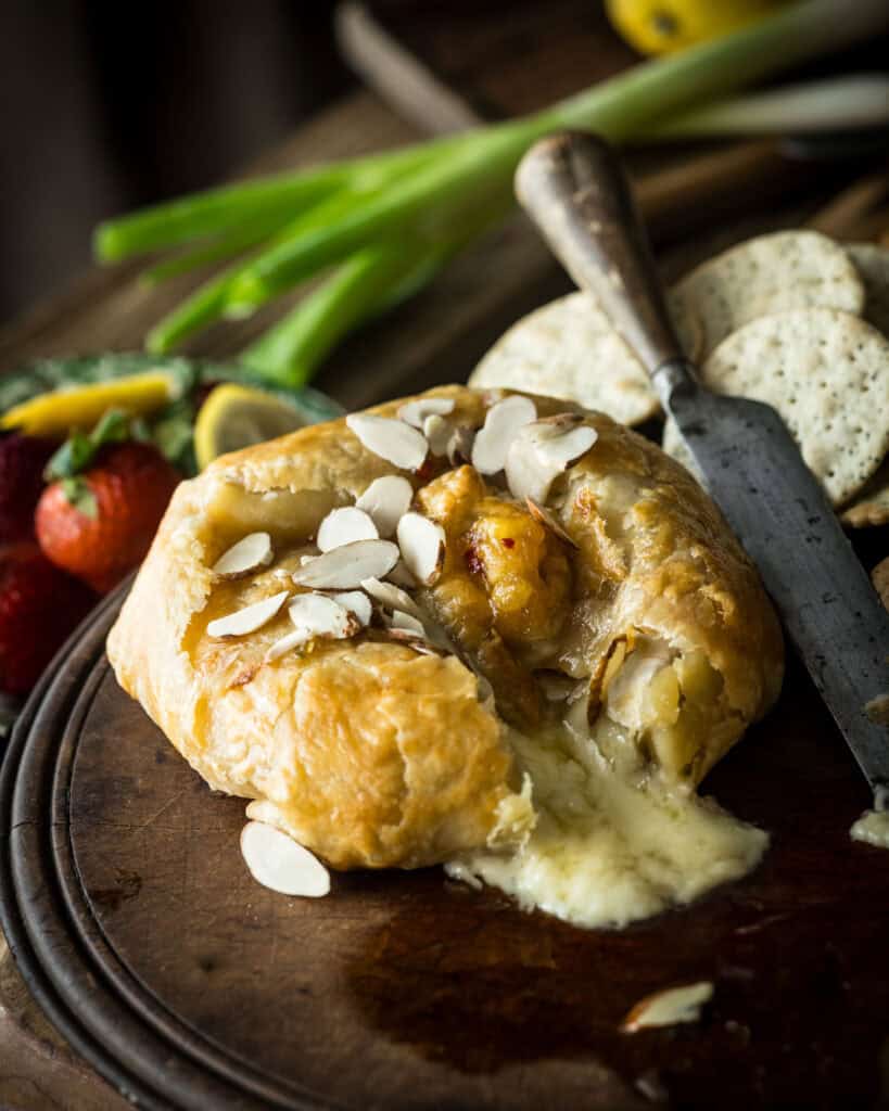 Close up of baked brie with spicy peach jam