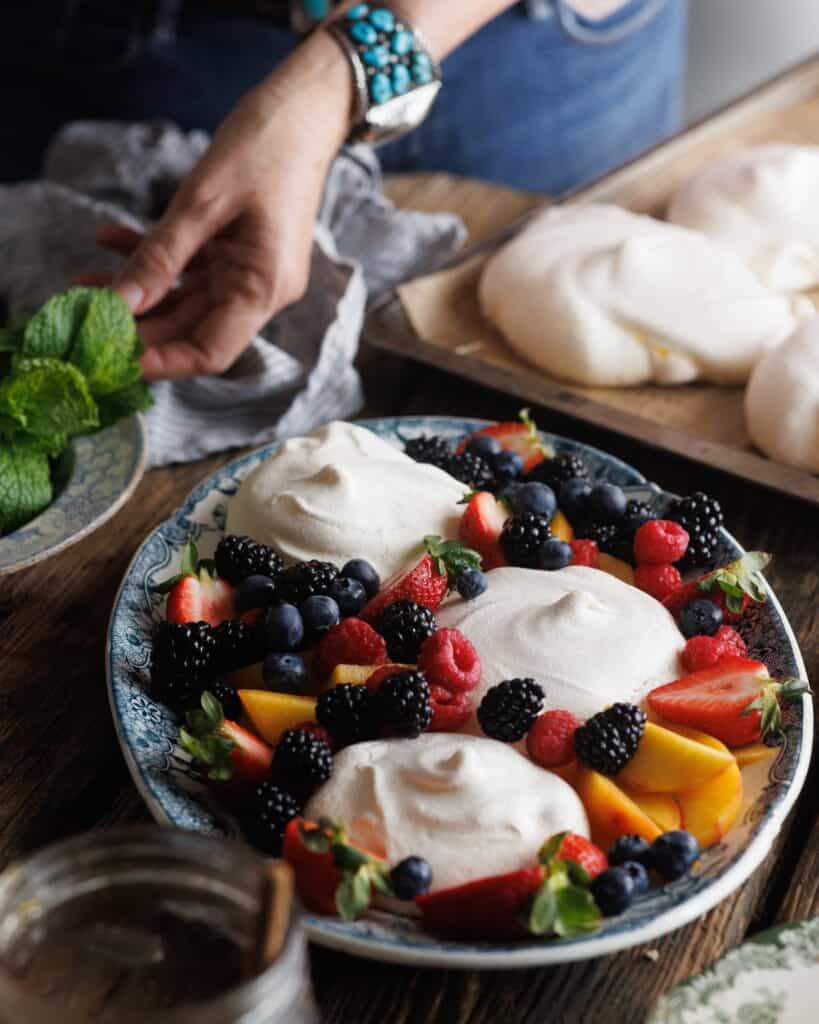 platter of Summer Pavlovas with honey smashed raspberries