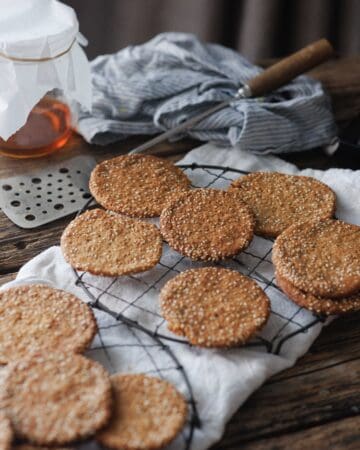 cooling rack full of Honey Sesame Snaps