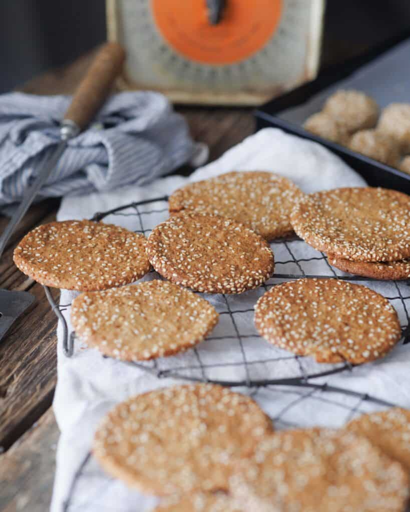 cooling rack full of Honey Sesame Snaps