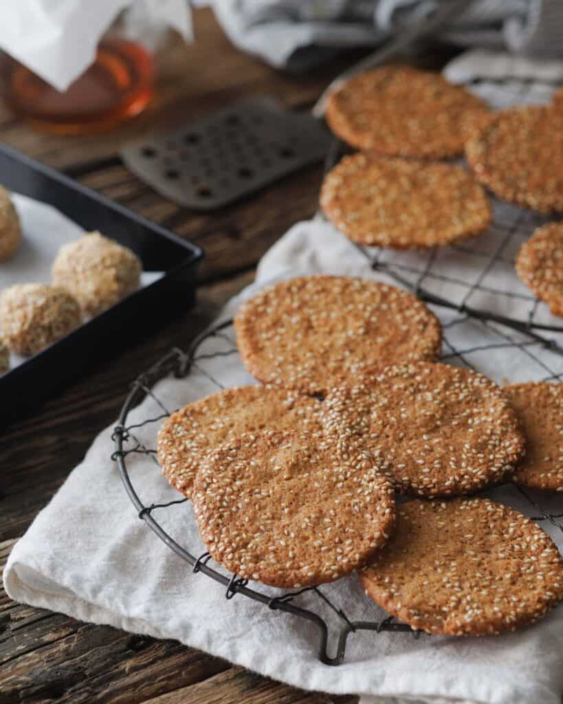 cooling rack full of Honey Sesame Snaps