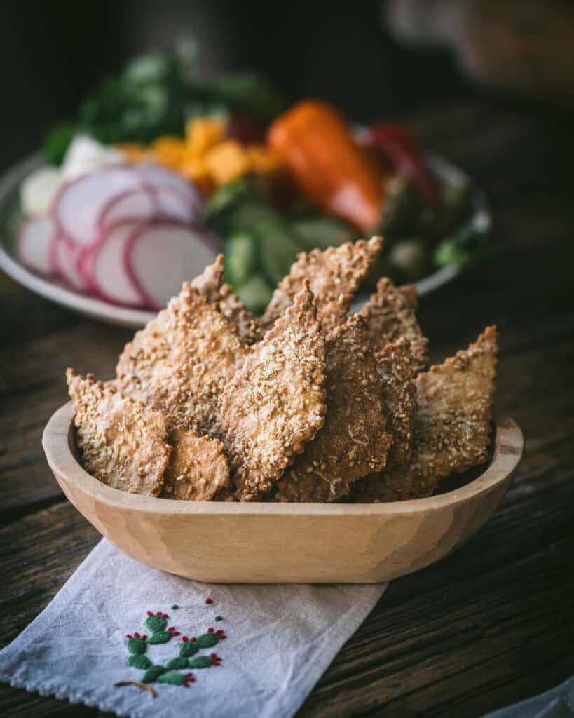 bowl of Sesame Cheese crackers on wooden table