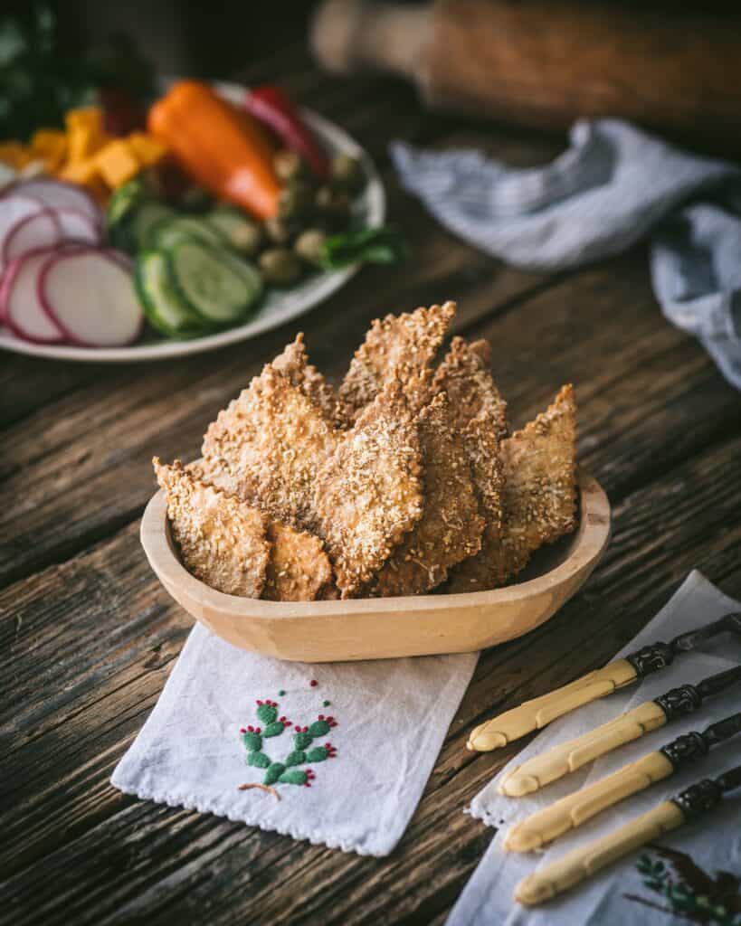 bowl of crackers on wooden table